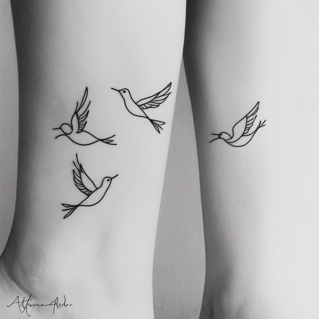 Small fine line minimalist tattoo for the ankle of a women with an artistic twist of the two flying birds - please ensure pictures are really small